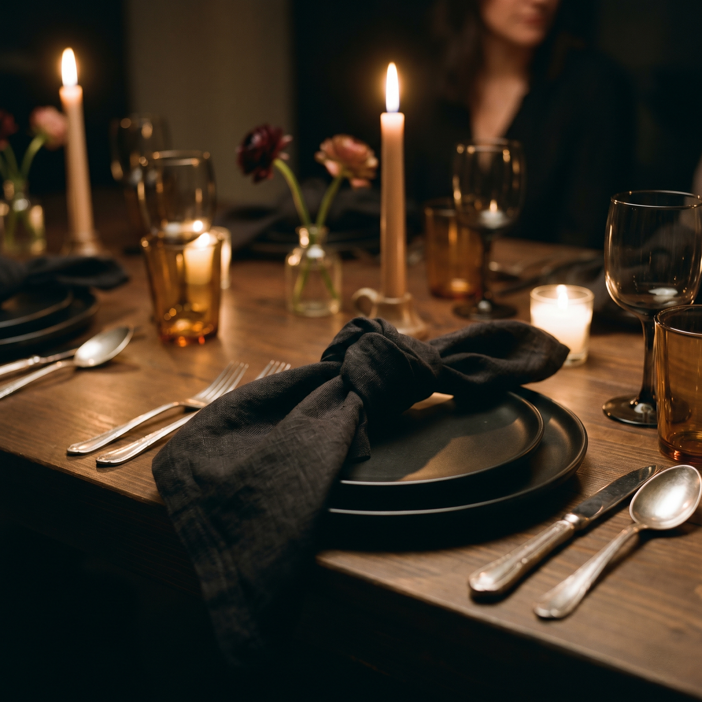 Black plain linen napkins styled on an event table setting