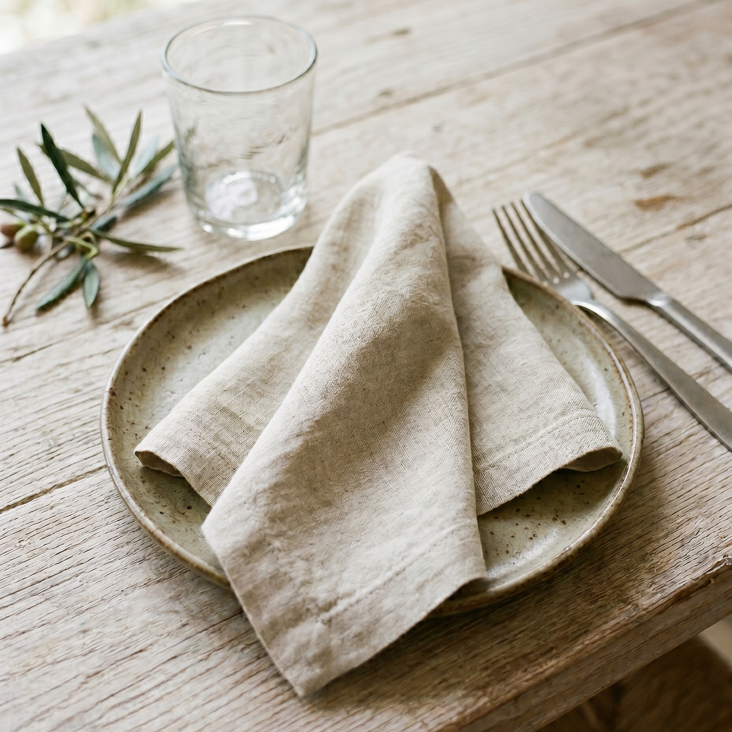 Sand plain linen napkin styled at a table place setting